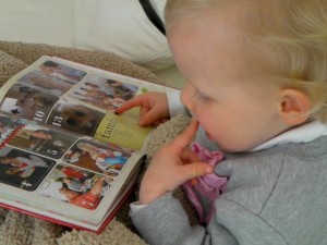 Baby looking at photobook