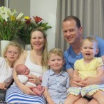 Melissa Shanhun and family sitting posing for the camera