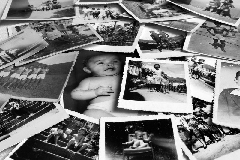 Pile of black and white deckle edge photos